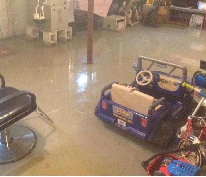 water covering basement floor, small jeep toy