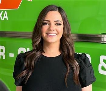 Woman standing in front of SERVPRO Fleet 