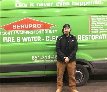 conner posing in front of SERVPRO truck