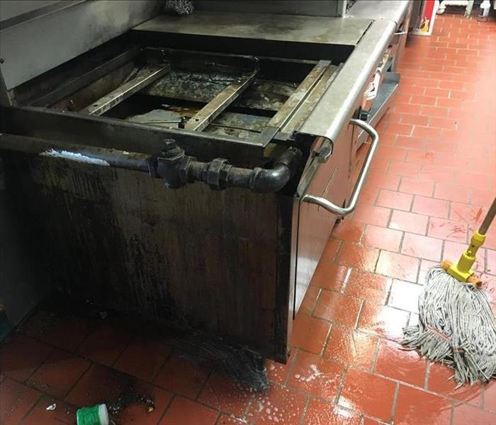 grease on floor and oven, mop