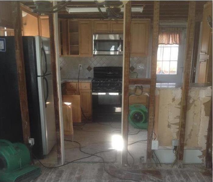 opened wall, kitchen  hardwood floors, air movers
