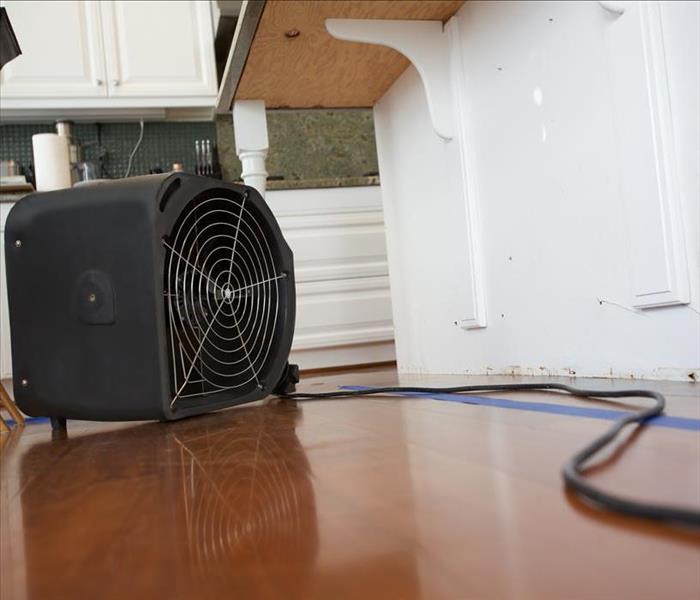 Air mover on a kitchen floor. 